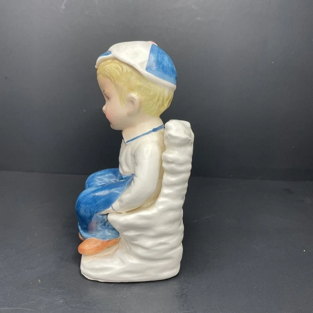 Vintage Boy Wearing Cap Saluting & Sitting Cross‎ Legged Bud Vase White & Blue